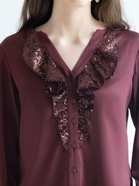 Close up of sequin frill detail along V-neck and button placket on brown Gramercy Shirt