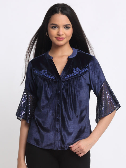 Model wearing blue Velvet Lexie Shirt with band collar V-neck three-quarter frill sleeves and embroidered yoke