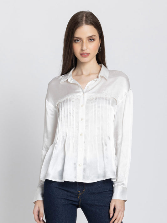 Model wearing white satin Minnie Shirt with shirt collar full sleeves button down front lace and pintuck detail