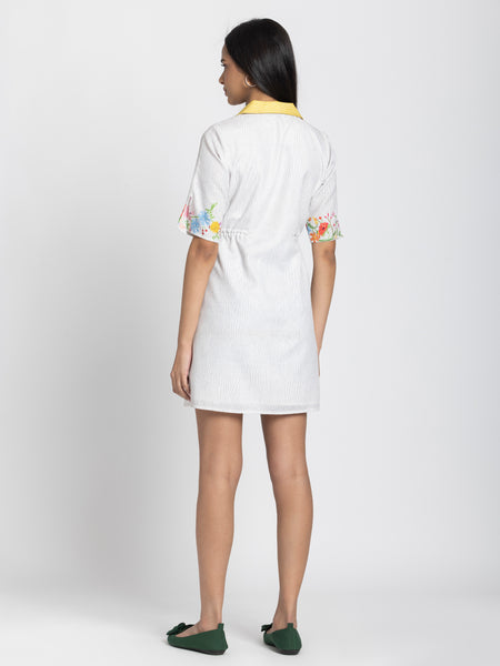 Rear view of Adira Dress showing floral print linen relaxed fit short sleeves and straight hem