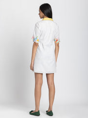 Rear view of Adira Dress showing floral print linen relaxed fit short sleeves and straight hem