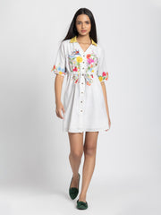 Full body shot of model in Adira Dress showing button down front short sleeves straight hem and floral print