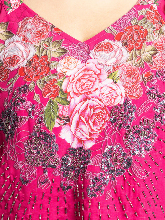 Close up of V-neck and detailed hand embroidery on the front of pink Ambre Top in lightweight georgette