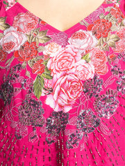 Close up of V-neck and detailed hand embroidery on the front of pink Ambre Top in lightweight georgette