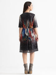 Back view of beige Jamie sequin dress showing gathered waist and straight hem construction