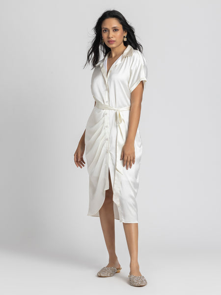 Side profile of Bernadette Dress displaying pleats detail belt and relaxed fit silhouette in satin 