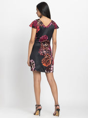 Rear view of Bianka Dress featuring back V-neck short cap sleeves and soft flowy satin fabric