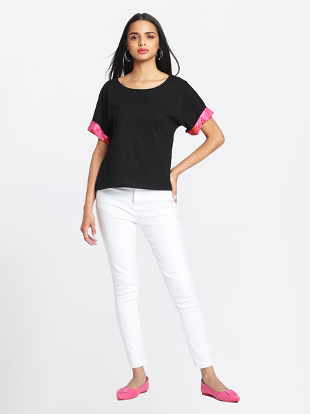 Black Laurina t-shirt styled casually with white pants comfortable scoop neck jersey top outfit inspiration