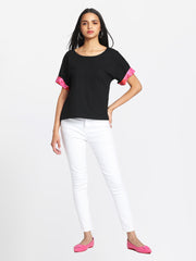 Black Laurina t-shirt styled casually with white pants comfortable scoop neck jersey top outfit inspiration