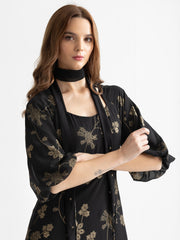 Close-up of short bishop sleeve on Bondi dress showing gold foil print and lightweight georgette