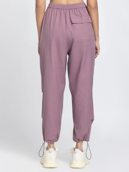 Rear angle of Capri Pants showing patch pocket on back ankle toggles and soft cotton parachute fabric