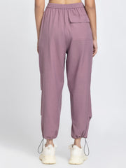 Rear angle of Capri Pants showing patch pocket on back ankle toggles and soft cotton parachute fabric
