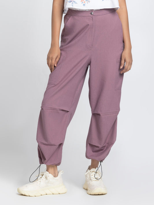Close up front view of mauve taupe Capri Pants showing high-rise waist slant pockets cargo and zipper closure