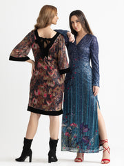 Styled view of blue Carey slim fit dress with floral sequin print