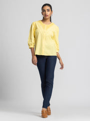 Full body shot of Ciara Shirt paired with jeans showing curved hem relaxed fit and embroidered yoke detail