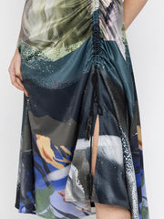 Close profile showing Dorina Dress with ruched adjustable cord side asymmetric hem and luxurious satin material