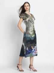Model in three quarter front pose wearing wrapped Dorina Dress with ruched side and soft satin fabric