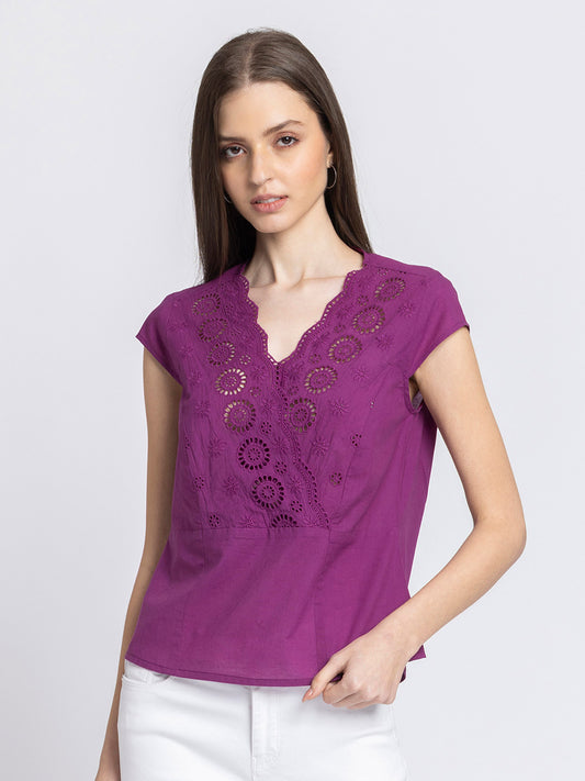 Model wearing purple Elvira Top with V-neck short cap sleeves Schiffli embroidery at front and straight hem