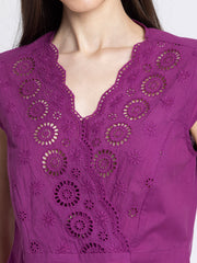 Close up of V-neck and Schiffli embroidery on front of purple Elvira Top showing overlap and delicate cotton fabric