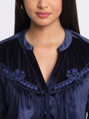 Close up of intricate yoke embroidery and sequin sleeve detail on blue velvet Lexie Shirt