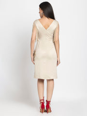 Back view satin sheath dress in beige with zipper closure, fringed sleeves, floral sequin patches, straight hem