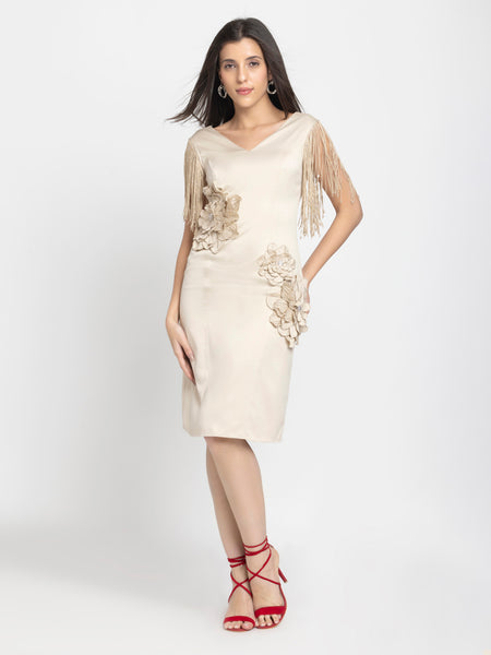 Full length pose of beige sheath satin dress with fringed sleeves, floral sequin patches, zipper back, fitted cut