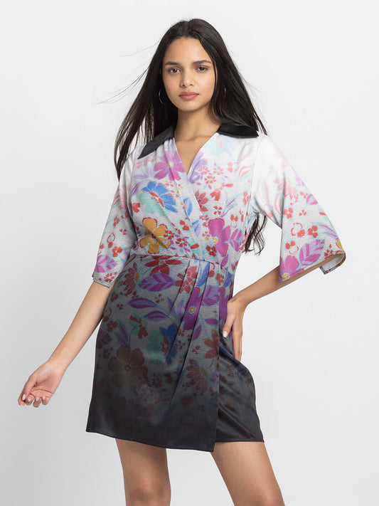 Model wearing black floral print Florale Dress with V-neck contrast collar wrap panel three-quarter sleeves and pleated bottom