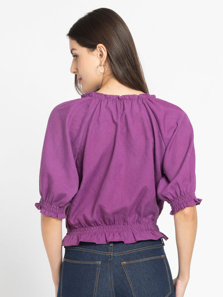 Rear view of Gorgeouso Top showing relaxed fit and smooth poly slub fabric with gathered hem and sleeves
