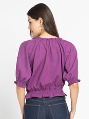 Rear view of Gorgeouso Top showing relaxed fit and smooth poly slub fabric with gathered hem and sleeves