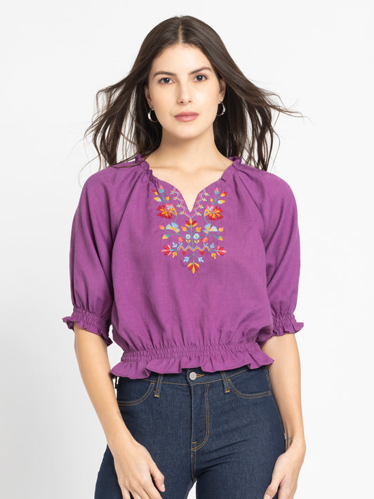 Model wearing purple Gorgeouso Top with round neck front embroidery short sleeves and relaxed fit