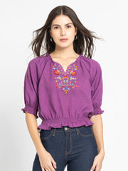 Model wearing purple Gorgeouso Top with round neck front embroidery short sleeves and relaxed fit