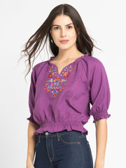 Side pose of Gorgeouso Top showing smocked sleeves curved hem and soft breathable poly slub fabric