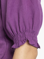 Close up of smocked cuff and embroidered sleeves on breathable poly slub fabric Gorgeouso Top