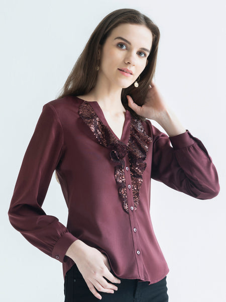Side view of brown Gramercy Shirt highlighting full sleeves sequin frill and curved hem silhouette