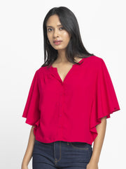 Side view of Jacqueline Shirt showing gathers at yoke curved hem and breathable fuchsia viscose rayon fabric