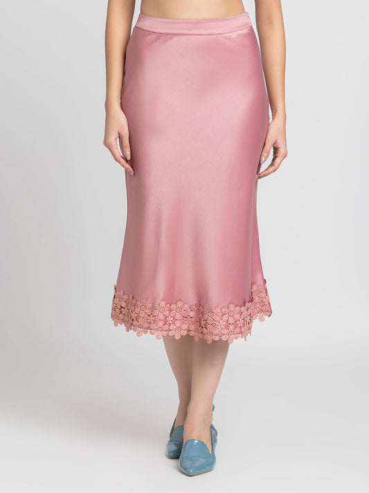 Front view of dusty pink Kagura Skirt with lace detail at hem bias cut relaxed fit and soft flowy satin fabric