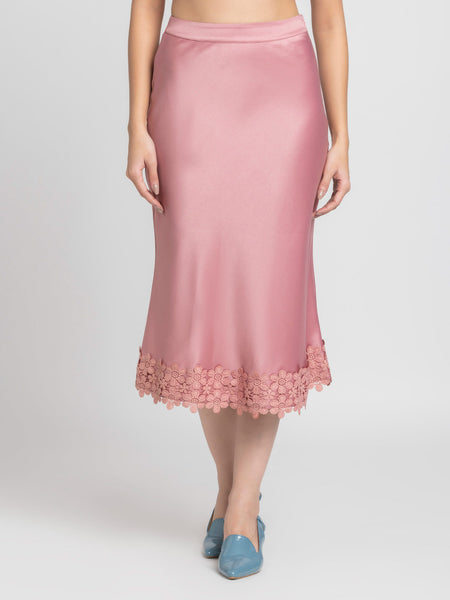 Front view of dusty pink Kagura Skirt with lace detail at hem bias cut relaxed fit and soft flowy satin fabric