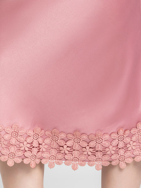 Close up of intricate lace detail at hem on Kagura Skirt showcasing soft dusty pink satin and elegant finish