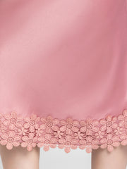 Close up of intricate lace detail at hem on Kagura Skirt showcasing soft dusty pink satin and elegant finish
