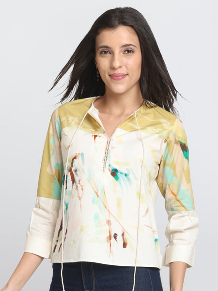Model with hands on hips in Karissa Top highlighting three quarter sleeves round neck and curved hem style