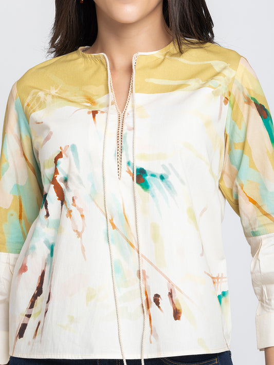Close up of round neck with slit and tie up detail on beige printed Karissa Top in ultra soft breathable cotton