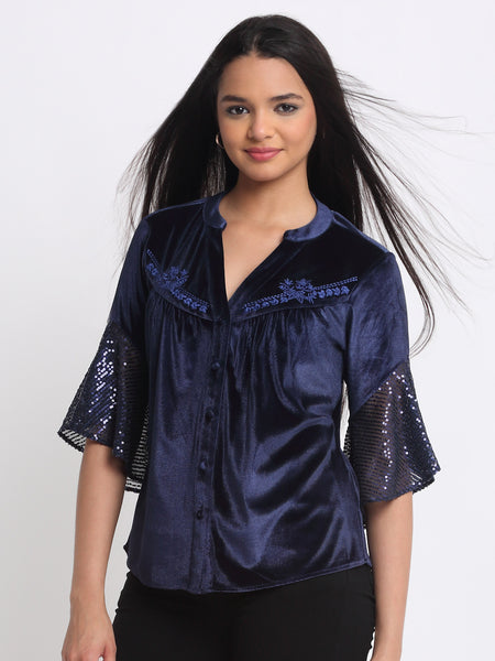 Angled pose showcasing band collar V-neck and embroidered yoke on Lexie Shirt