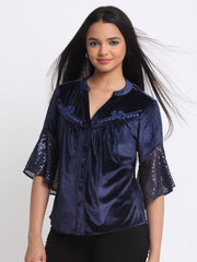 Angled pose showcasing band collar V-neck and embroidered yoke on Lexie Shirt
