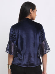 Rear view of blue velvet Lexie Shirt showing curved hem relaxed silhouette