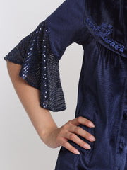 Close up of three-quarter frill sleeve sequin embellishment and curved hem edge on Lexie Shirt