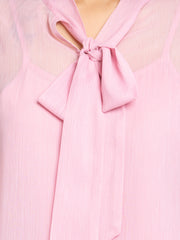 Close up of elegant tie up neck with bow detail on pink chiffon Maine Top showcasing light floral print