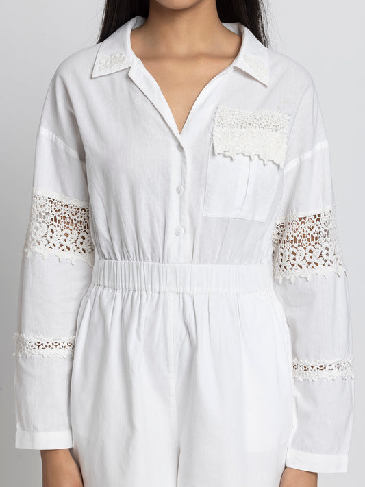Close up of spread collar lace patch detail and patch pocket on white cotton Maleah Playsuit