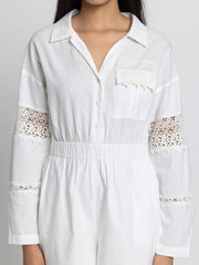 Close up of spread collar lace patch detail and patch pocket on white cotton Maleah Playsuit