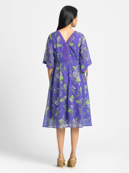 Rear view of Mucia Dress with zipper back crochet neckline and lace details on bell sleeves