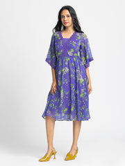Full-length front view of Mucia Dress showing straight hem zipper at back and relaxed fit in flowy chiffon